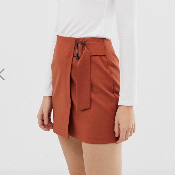 ASOS DESIGN wrap mini skirt with horn buckle - Picture 1 of 3